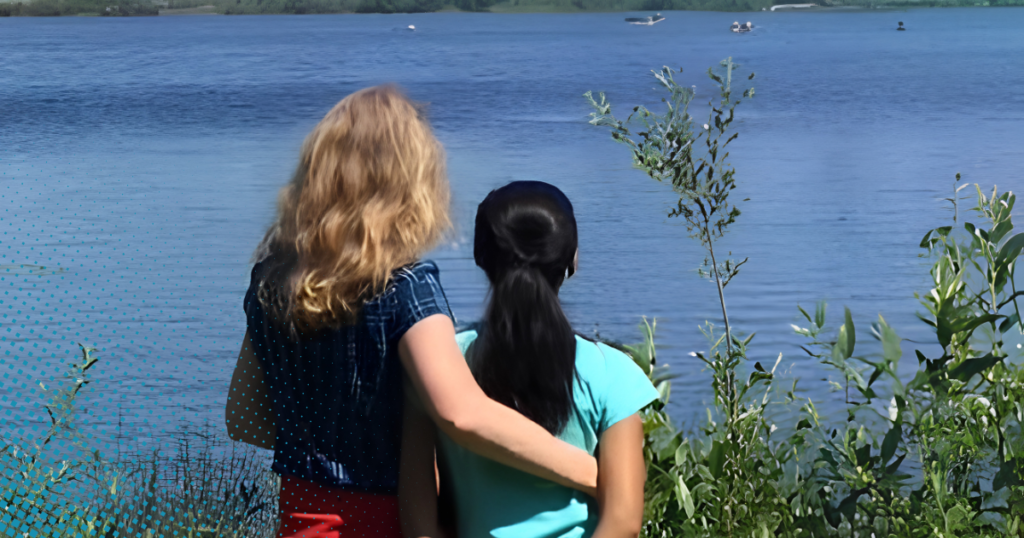 mom and daughter looking over lake when she came out as gay